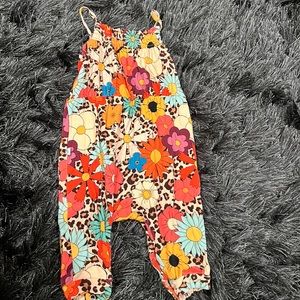 Post Peanut flower cheetah jumpsuit